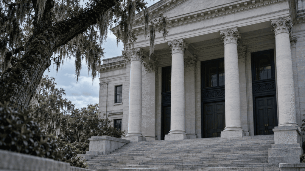 Columned federal courthouse entrance under a gray Louisiana sky, the kind of court that hears Western District of Louisiana immigration habeas petitions.
